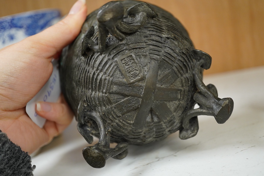A Japanese bronze censer shaped as a basket on three legs. 8.5cm high.